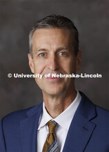Studio portrait of Tom Thompson, Senior Director of Development, Fred and Pamela Buffett Cancer Cent