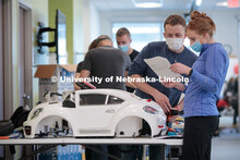 UNL engineering student Ethan Bowles, right, and UNMC physical therapy student Jaime Troester modify