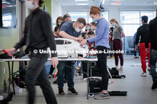 UNL engineering student Ethan Bowles, right, and UNMC physical therapy student Jaime Troester modify