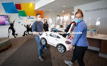 UNL engineering student Ethan Bowles, left and UNMC physical therapy student Jaime Troester deliver 