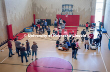 UNL engineering students and UNMC physical therapy students deliver the battery-powered cars to the 