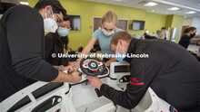Huskers Ricardo Gato Gil (left) and Chandler Brock (right) work as a team with Yuqi Pu (second from 