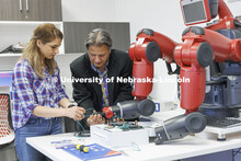 Kimia Ameri and Hamid Sherif work with a robotic arm in Hamid Sherif’s lab. College of Engineering