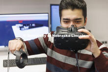Pejman Ghasemzadeh works on a virtual reality project in Hamid Sherif’s Telecom lab. College of En