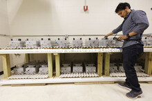 Dipendra Shrestha measures conductivity of a concrete block in Chungwook Sim’s Macrocell Corrosion