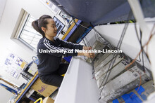 Yalei Tang works in Jinying Zhu lab at PKI. College of Engineering photo shoot at Peter Kiewit Insti