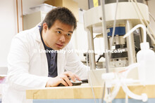 Ferdinand Calaunan runs a test in Seunghee Kim’s lab. College of Engineering photo shoot at Peter 