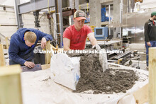 Braden Labenz, a junior from Columbus, Nebraska, works on a cross section as part of the concrete ca
