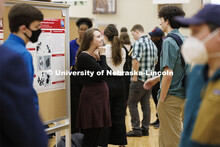 Maggie Ramsey listens to questions about her chemistry research project. Undergraduate Student Poste