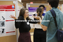 Maggie Ramsey debates her chemistry research project with a fellow student. Undergraduate Student Po