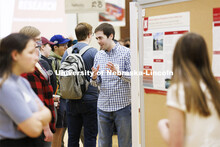 Jonathan Wear answers questions while discussing the geology research. Undergraduate Student Poster 
