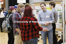 Jonathan Wear answers questions while discussing the geology research. Undergraduate Student Poster 