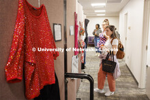 Graduate students Elyxcus Anaya and Jessica Boyles examine the “What Were You Wearing?” survivor