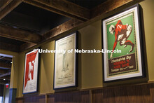 Classic Husker football posters hang in an eating space within the new Scarlet Hotel. The Scarlet Ho