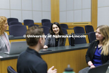 Students collaborating in a lecture hall in McCollum Hall. College of Law photo shoot. April 20, 202