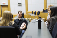 Students collaborating in a lecture hall in McCollum Hall. College of Law photo shoot. April 20, 202