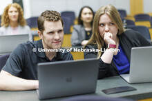 Students collaborating in a lecture hall in McCollum Hall. College of Law photo shoot. April 20, 202