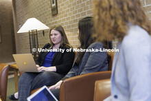 Students gathered in the hallway in McCollum Hall. College of Law photo shoot. April 20, 2022. 
