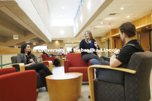 Students hanging out socializing in the hallway. College of Law photo shoot. April 20, 2022. 