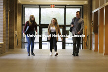 Students walking to class in McCollum Hall. College of Law photo shoot. April 20, 2022. 