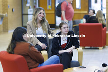 Students hanging out socializing in the hallway. College of Law photo shoot. April 20, 2022. 