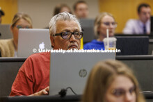 Students taking notes in class. College of Law photo shoot. April 20, 2022. 
