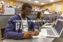 Students taking notes in class. College of Law photo shoot. April 20, 2022. 