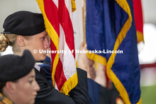 Cadet Sophie Byland holds the flag during the ROTC Joint Service Chancellor’s Review in Cook Pavil