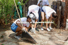 Emerging Leaders in Diversity assist with yard work at 621 Lakewood Drive. The Big Event is organize