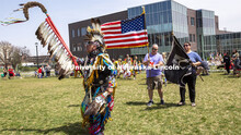 Scott Aldrich, head man dancer (left) leads the colors into the circle at the start of the UNITE pow