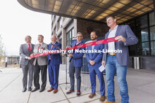 UNL Chancellor Ronnie Green cuts the ribbon for the new hotel. Ribbon cutting for the new Scarlet Ho