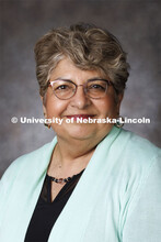 Studio portrait of Omega Barcenas, Nutrition Extension Educator. Portraits of Extension, IANR and CA