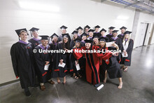 Grads pose for a group photo. Graduate commencement in Pinnacle Bank Arena. May 13, 2022. 