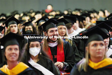 Graduates are seated for the commencement ceremony. Graduate commencement in Pinnacle Bank Arena. Ma