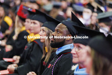 Graduates are seated for the commencement ceremony. Graduate commencement in Pinnacle Bank Arena. Ma