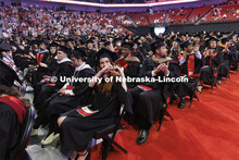 Crystal Zahler gives her love to her family in the arena. Graduate commencement in Pinnacle Bank Are
