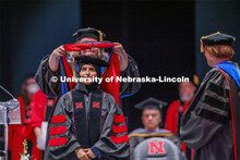Hooding at graduate commencement in Pinnacle Bank Arena. May 13, 2022. 