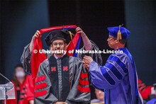 Hooding at graduate commencement in Pinnacle Bank Arena. May 13, 2022. 