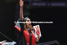 Samah Salim Al Sarhani waves to her family and friends after receiving her Masters of Architecture d