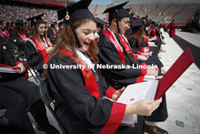 Chancellor’s Scholar Rose Seeman reacts as she looks at her certificate awarded to her along with 
