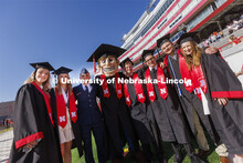 Engineering graduates pose with Herbie Husker before commencement. UNL undergraduate commencement in