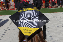 Decorated mortarboards at UNL undergraduate commencement in Memorial Stadium. May 14, 2022. 