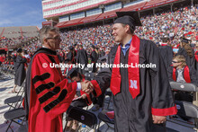 UNL Chancellor Ronnie Green chats with Grady Johnson. Johnson finished his degree online and tweeted