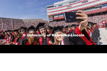 Madalyne Lorenze takes a selfie with her COJMC friends. UNL undergraduate commencement in Memorial S