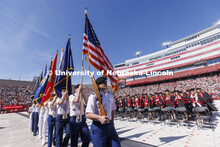 ROTC color guard marches in at the UNL undergraduate commencement in Memorial Stadium. May 14, 2022.