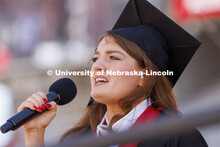 Rose Seeman sings the national anthem before the start of the UNL undergraduate commencement in Memo