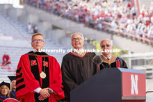 Terry Fairfield, center, along with UNL Chancellor Ronnie Green, left, and NU Regent Bob Phares watc
