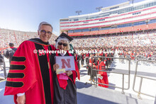 Carol (Dahl Leacox) Livingston receives her diploma from Chancellor Ronnie Green. Livingston finally