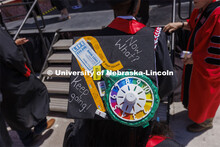 Decorated mortarboards at UNL undergraduate commencement in Memorial Stadium. May 14, 2022. 