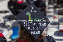 Decorated mortarboards at UNL undergraduate commencement in Memorial Stadium. May 14, 2022. 